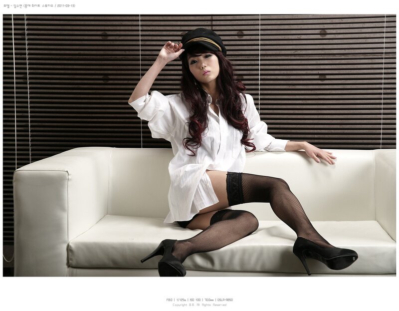 woman in white shirt and fishnet stockings