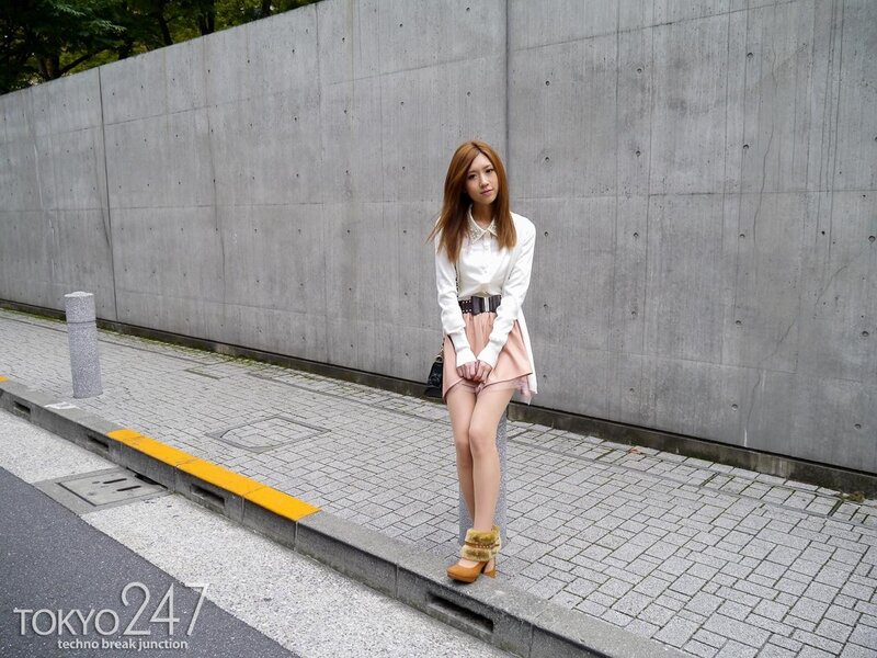Woman in white shirt and pink skirt