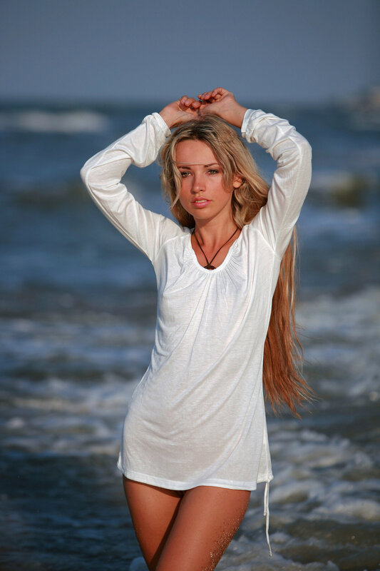Woman in white shirt at beach