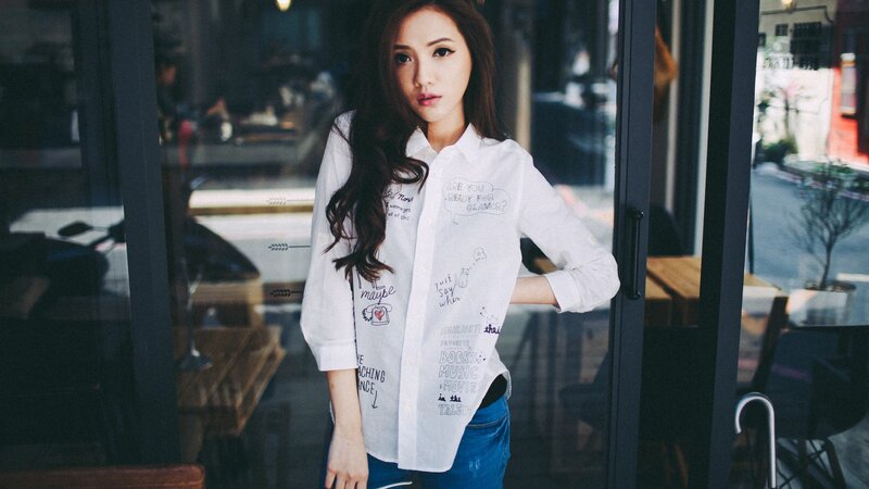 woman in white shirt at cafe