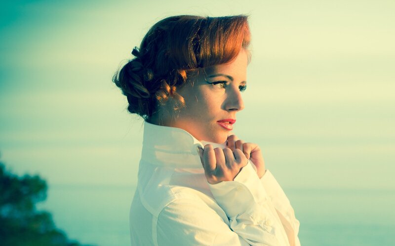 woman in white shirt at sunset