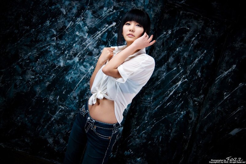 Woman in White Shirt — Black, Dramatic, Photograph, White Shirt, Jeans, Dark Background