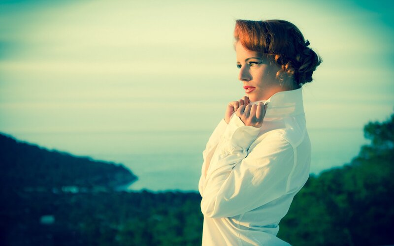 woman in white shirt by the sea