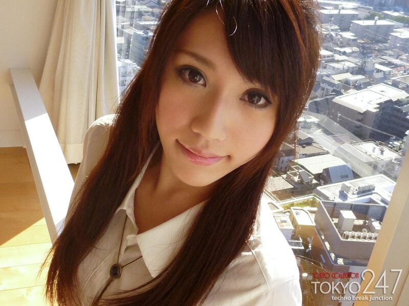 woman in white shirt by window