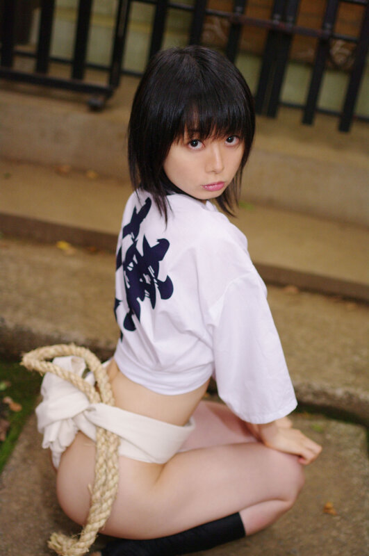 woman in white shirt crouching