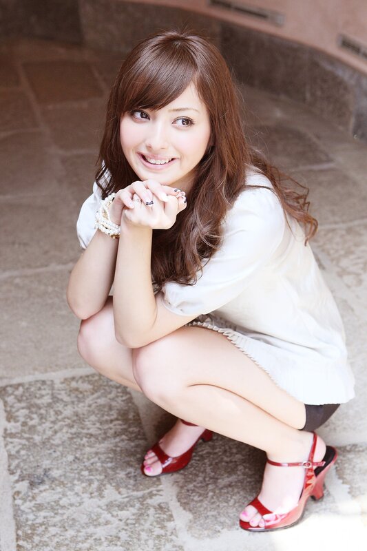 woman in white shirt crouching