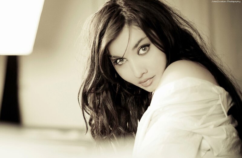 woman in white shirt looking at camera