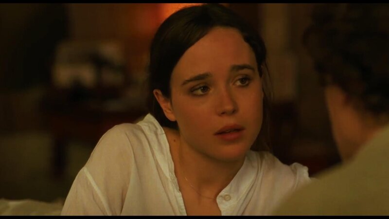 woman in white shirt looking concerned