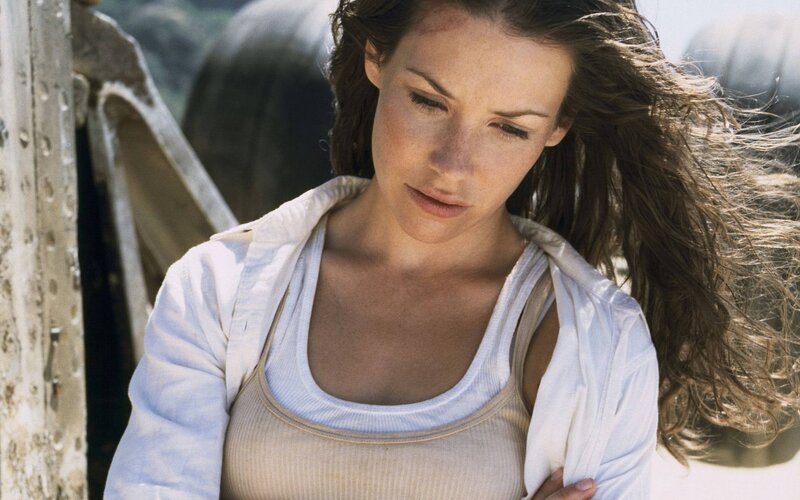 woman in white shirt looking down