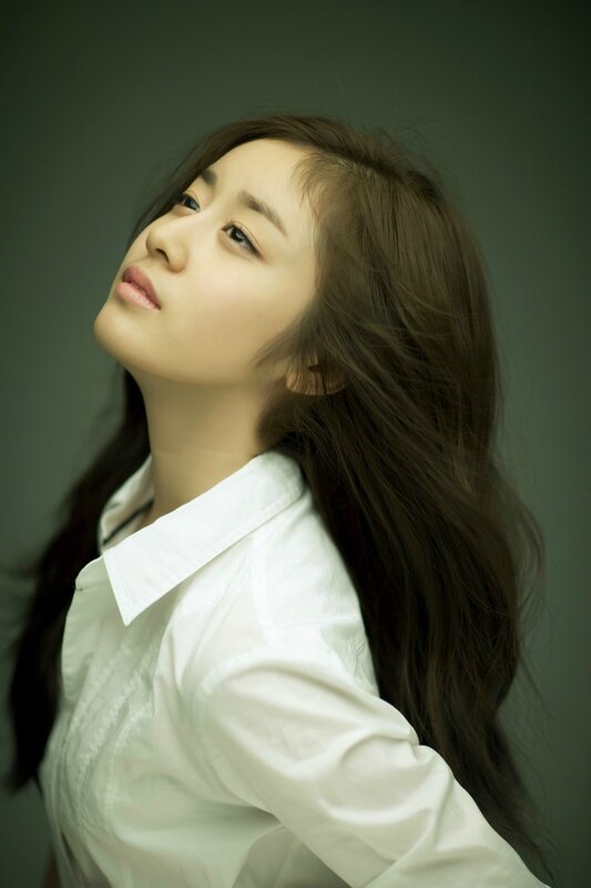 woman in white shirt looking up