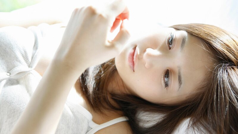 woman in white shirt lying down
