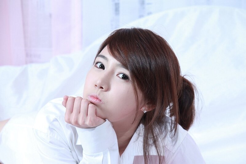 woman in white shirt lying down