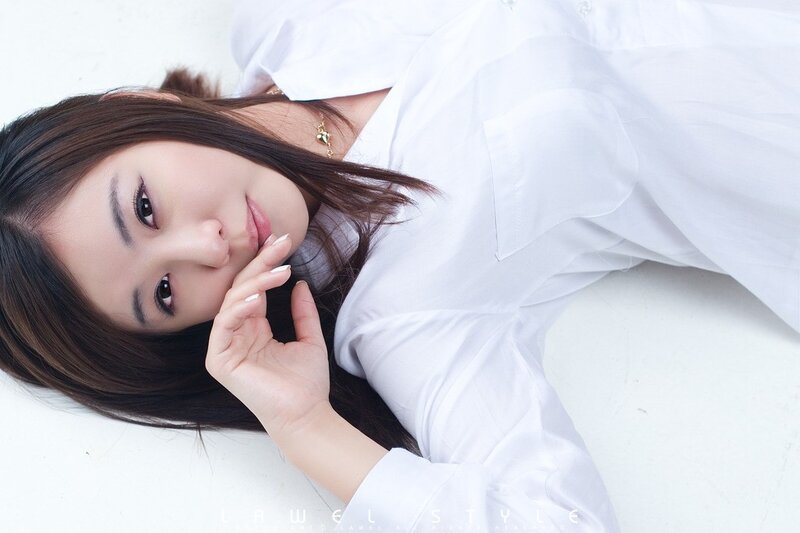 woman in white shirt lying down