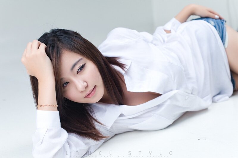 woman in white shirt lying down
