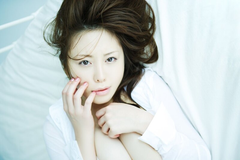 woman in white shirt lying down