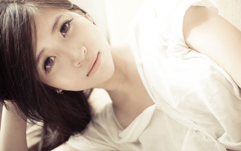 woman in white shirt lying down