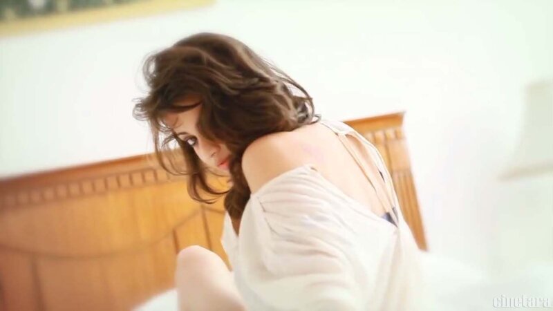 woman in white shirt on bed