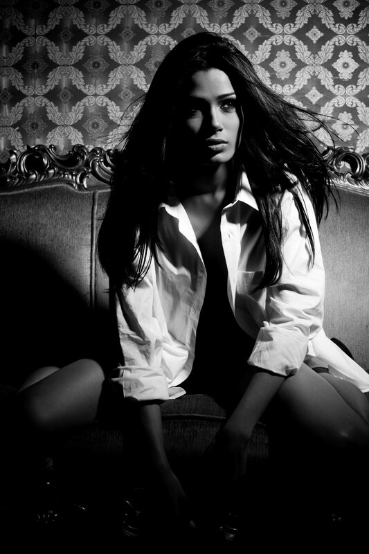 woman in white shirt on couch