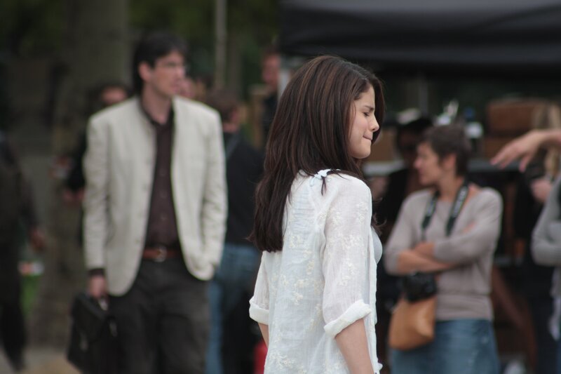 woman in white shirt on set
