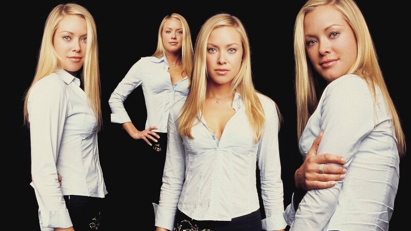 woman in white shirt poses