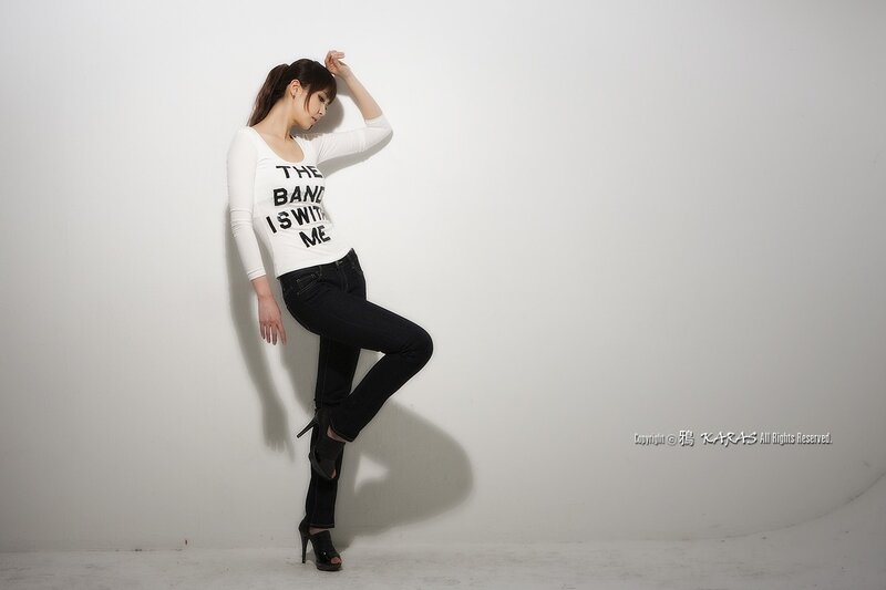 woman in white shirt posing