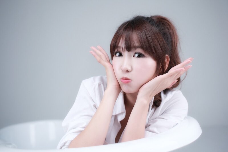 woman in white shirt posing
