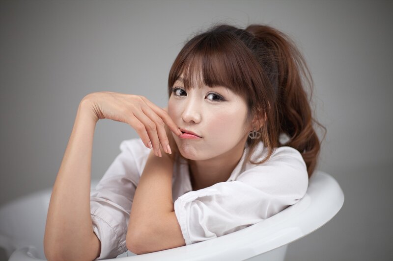 woman in white shirt posing