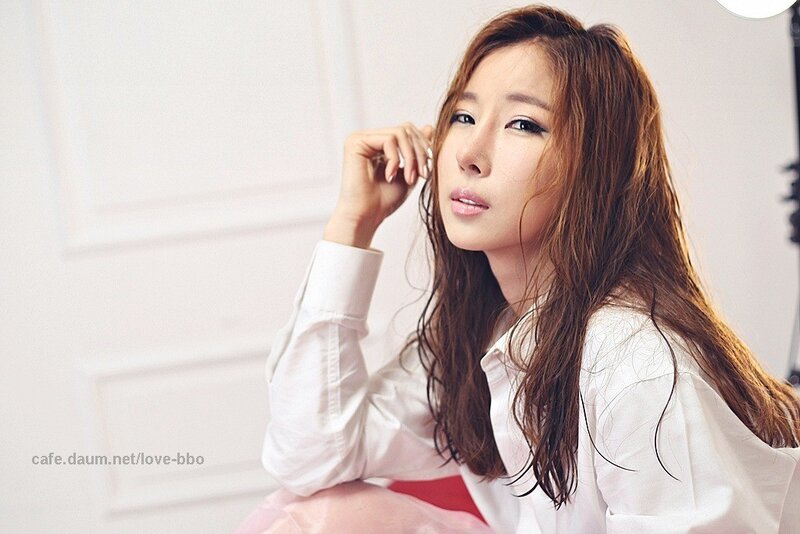 woman in white shirt posing