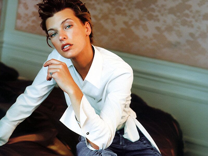 Woman in white shirt posing