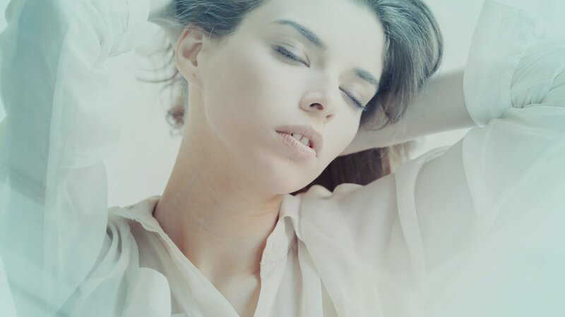woman in white shirt resting