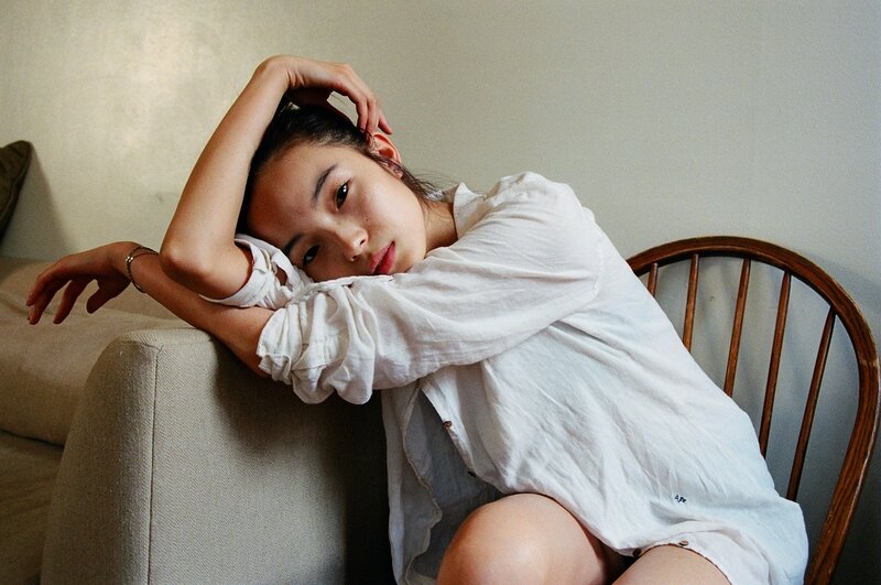 woman in white shirt resting
