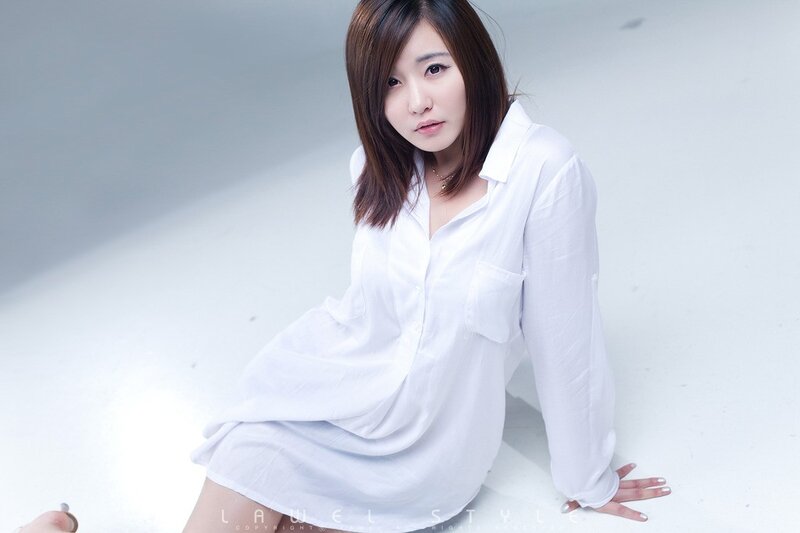 woman in white shirt sitting