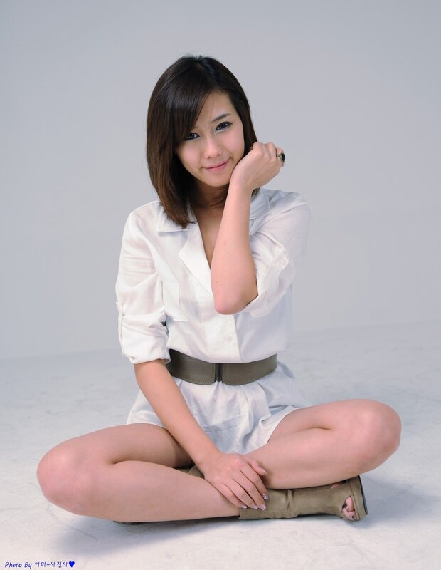 woman in white shirt sitting