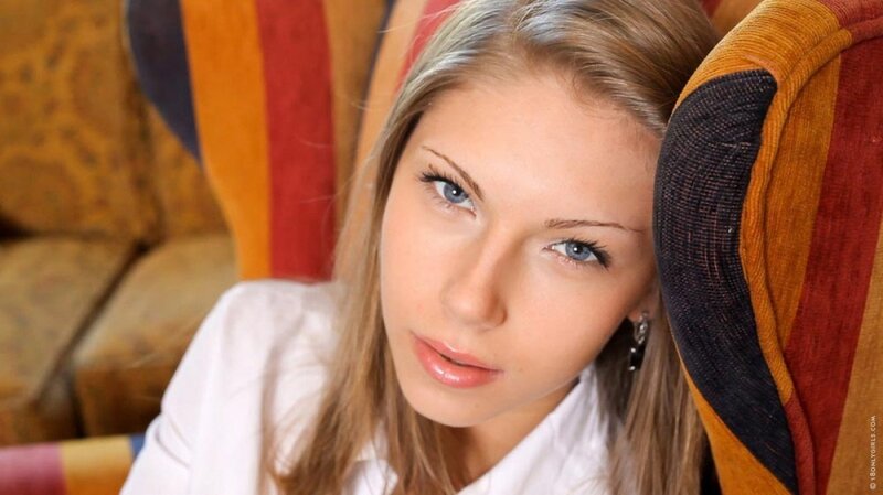 woman in white shirt sitting