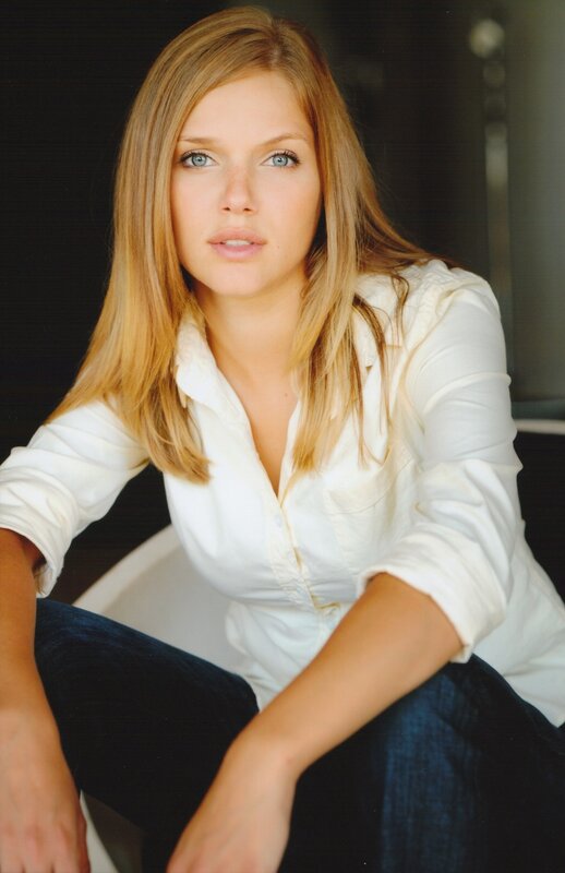 woman in white shirt sitting