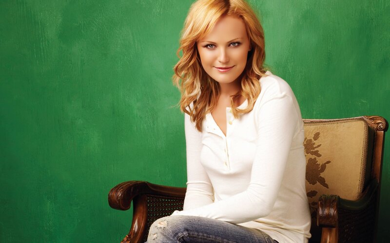 woman in white shirt sitting