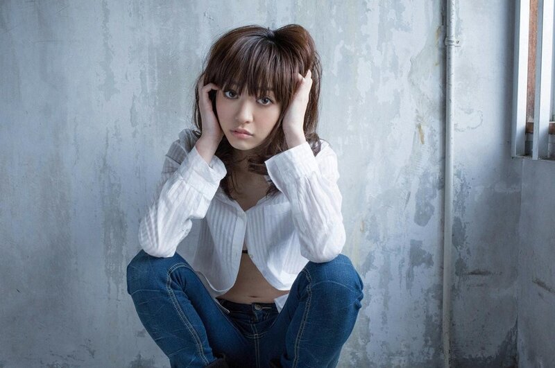 woman in white shirt sitting