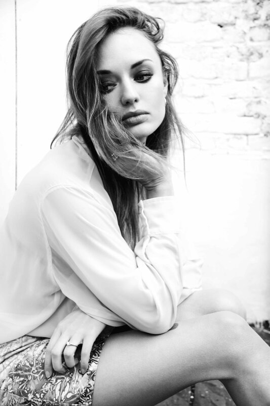 woman in white shirt sitting