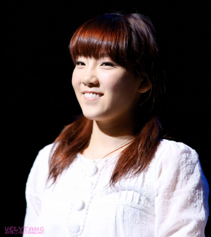 woman in white shirt smiling