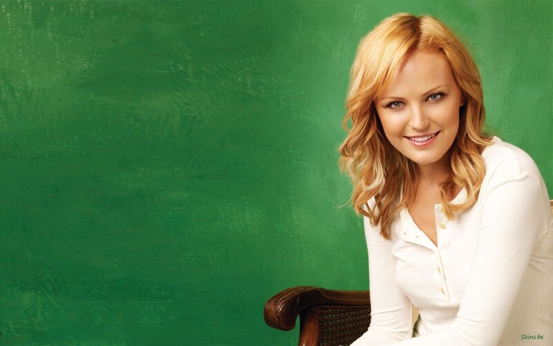 woman in white shirt smiling