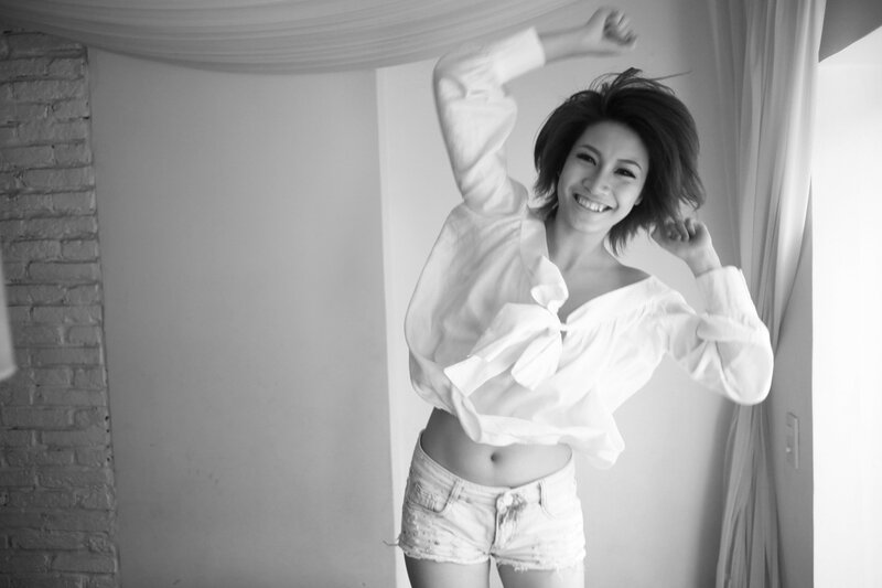 woman in white shirt smiling