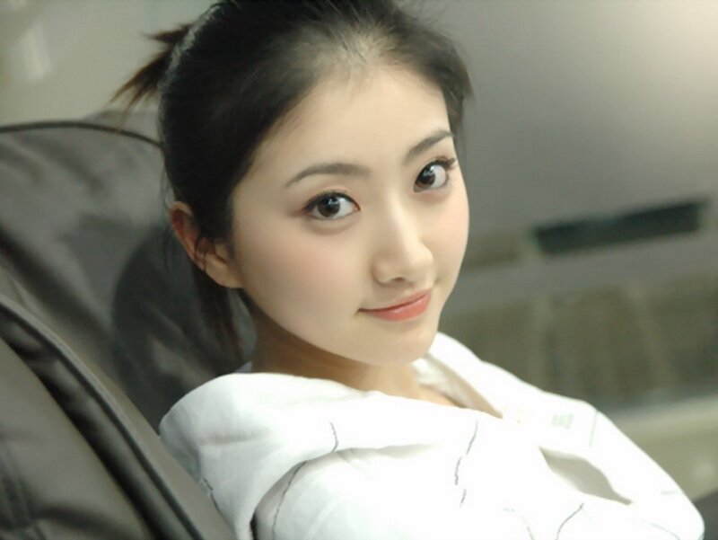 woman in white shirt smiling