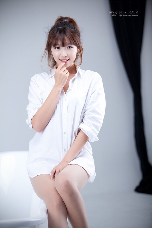 woman in white shirt smiling