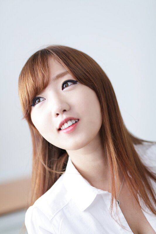 woman in white shirt smiling