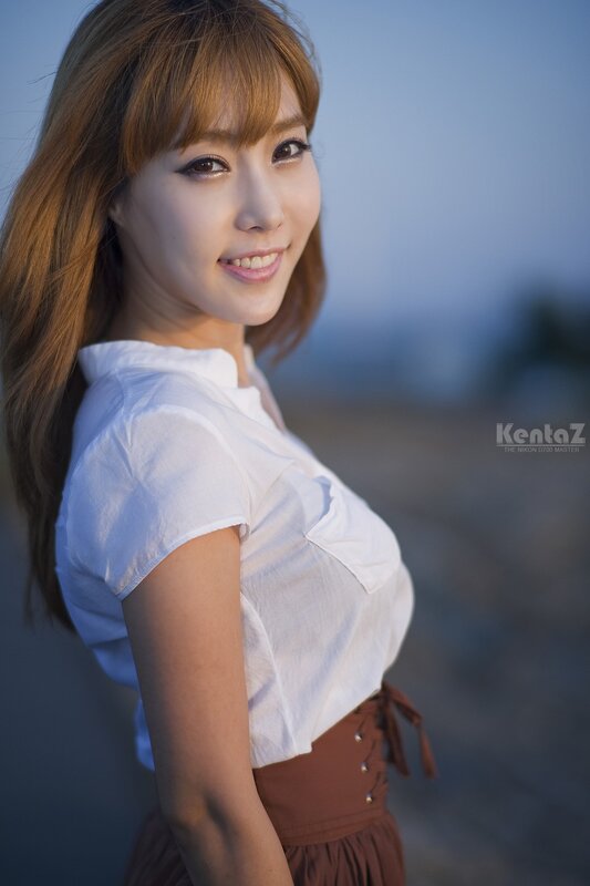 woman in white shirt smiling