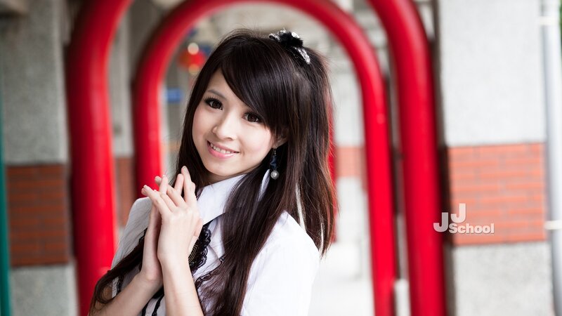 woman in white shirt smiling