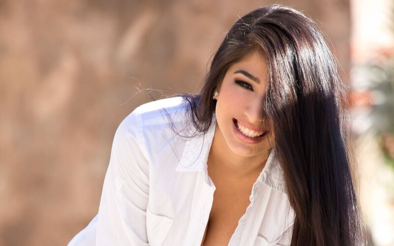woman in white shirt smiling