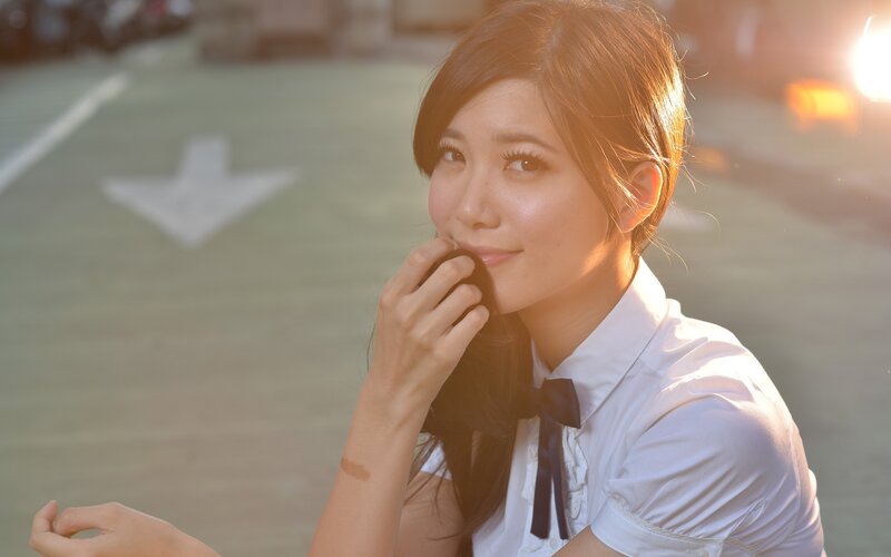 woman in white shirt smiling