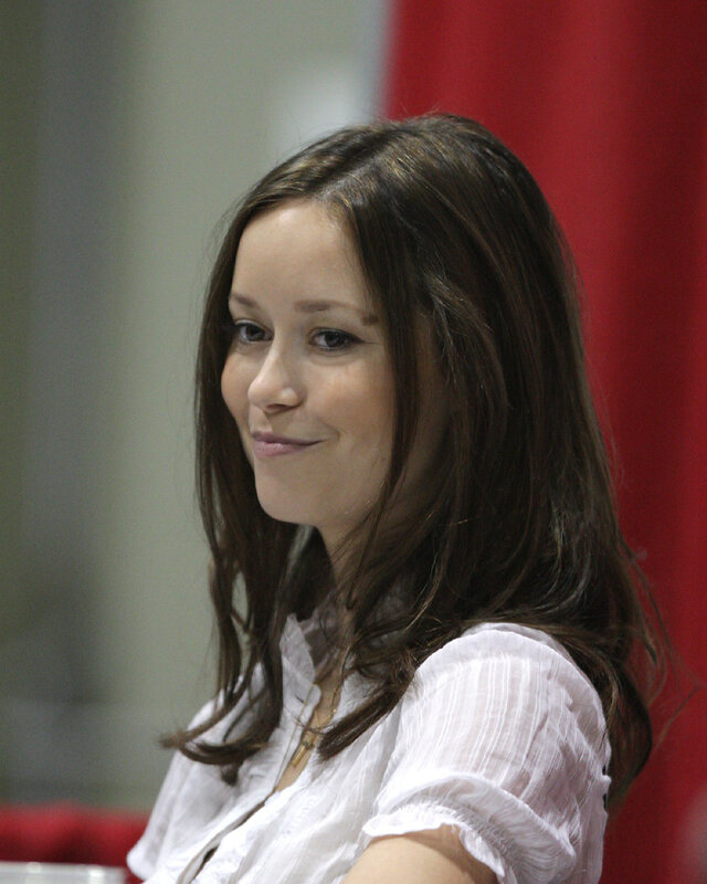 woman in white shirt smiling