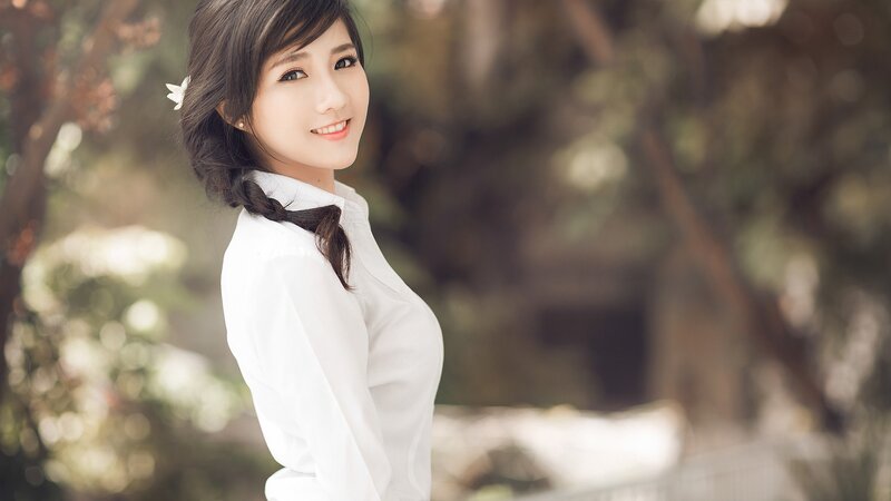 woman in white shirt smiling
